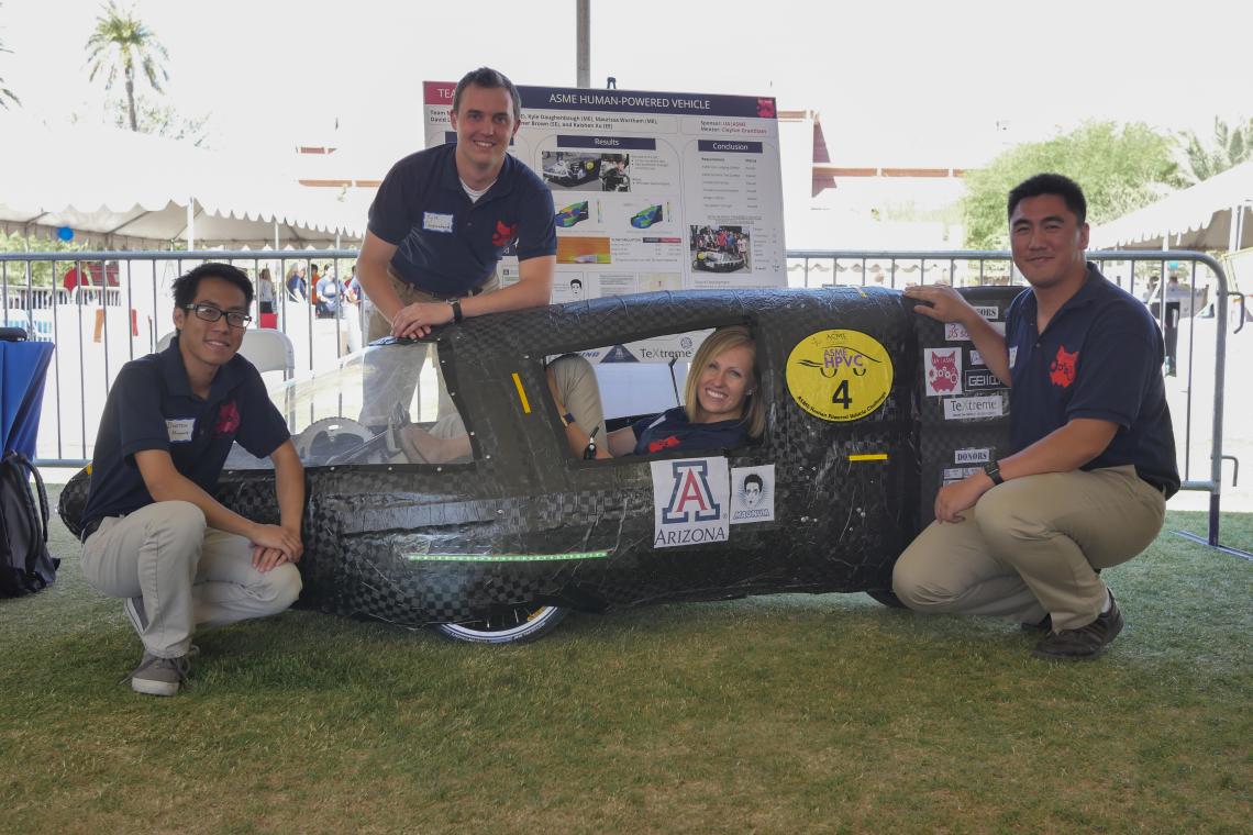 Kyle Daughenbaugh, standing behind the human-powered vehicle he built with teammates  Dustin Huynh, Maurissa Wortham and Christian Brown, translated his work on the 2015-2016 senior design project to working for Caterpillar.